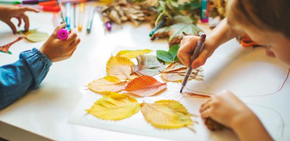Children doing autumn hand crafts